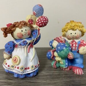 Enesco "Cute as a Button" collection, designed by Mary Rhyner.